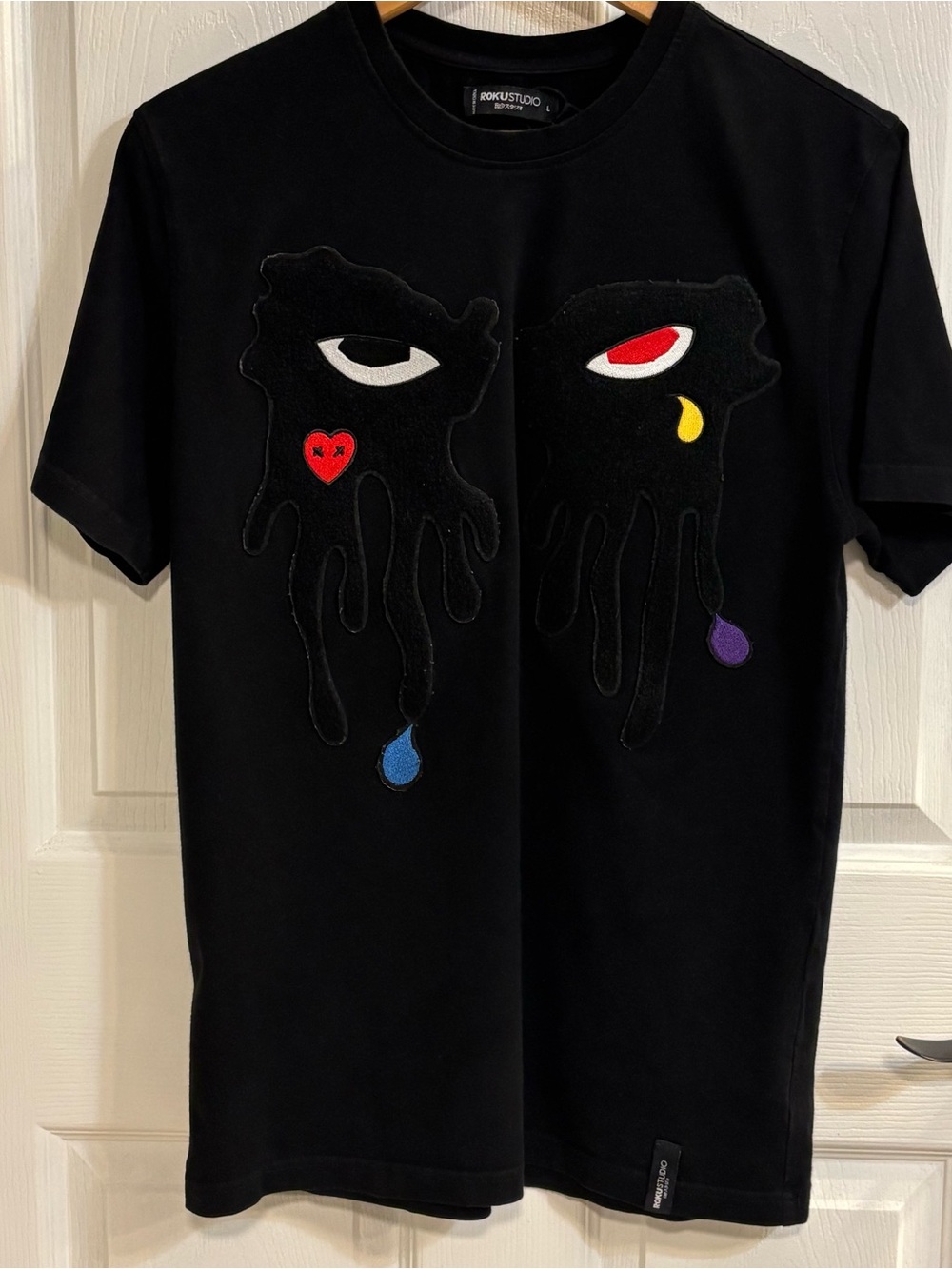 Roku Studio T Shirt Mens L Black Chenille Embroidered Hands Eyes Graphic Tee